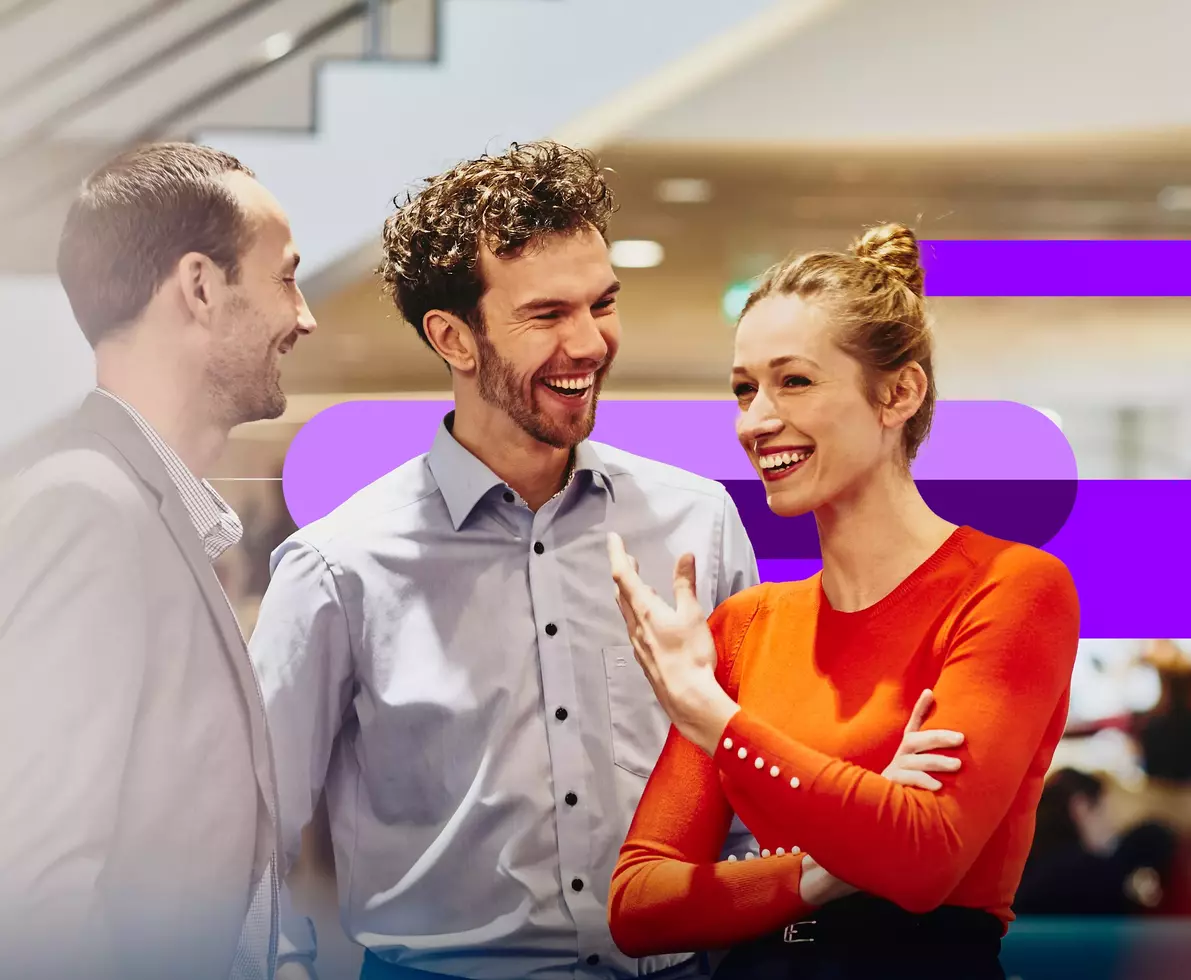 employees talking in an office boardroom